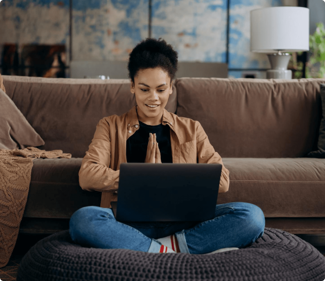 Smiling woman on laptop at home