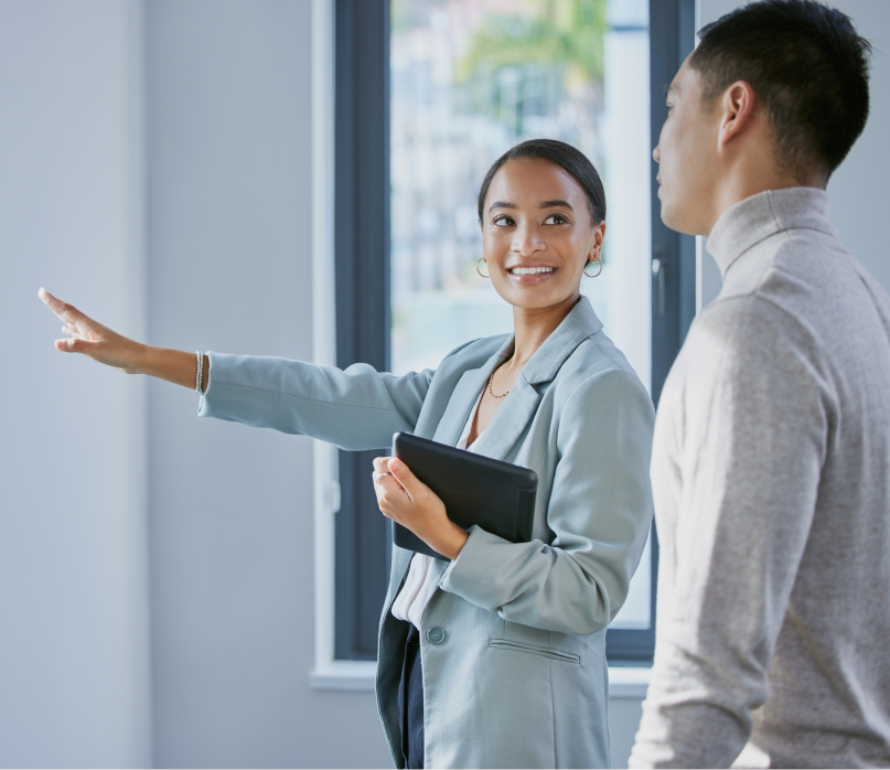 Real estate agent showing house